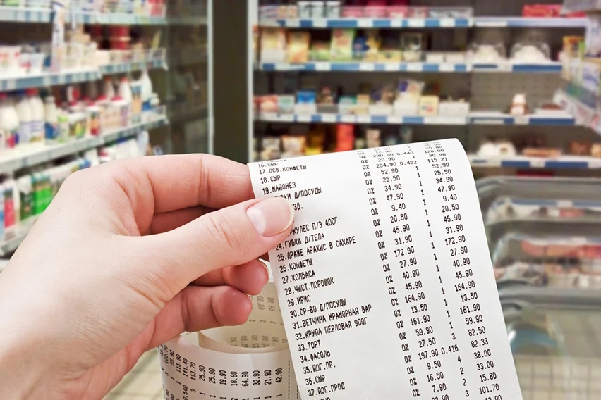 Hand holding a fiscal receipt