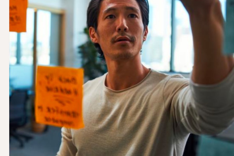 Person planning with sticky notes